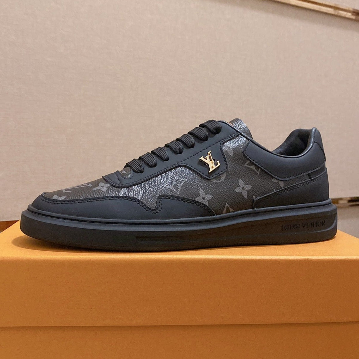 LV TRAINER IN BLACK MIX DARK BROWN CALFSKIN