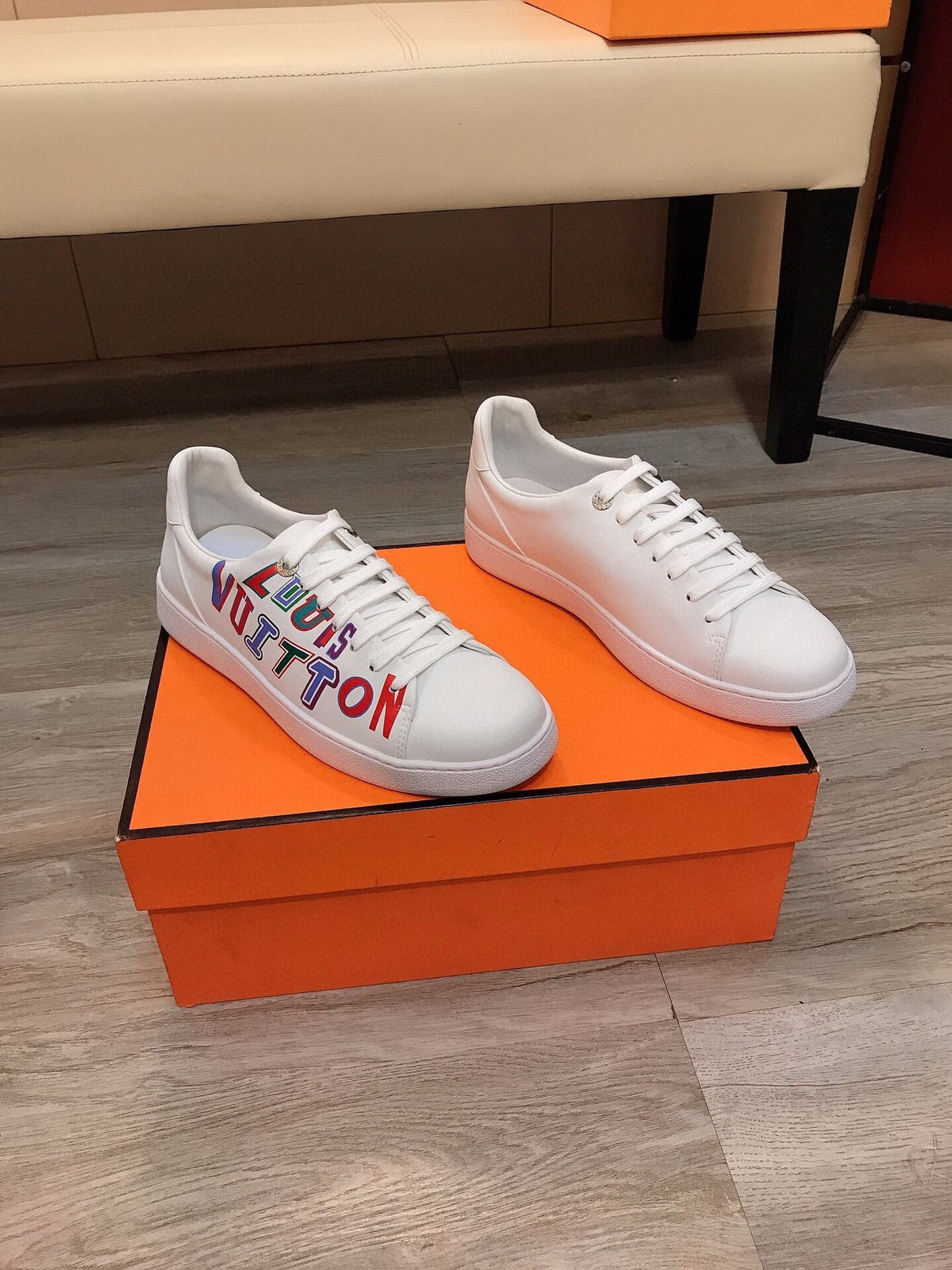LV TRAINER WHITE CALFSKIN WITH COLORFUL LOGO