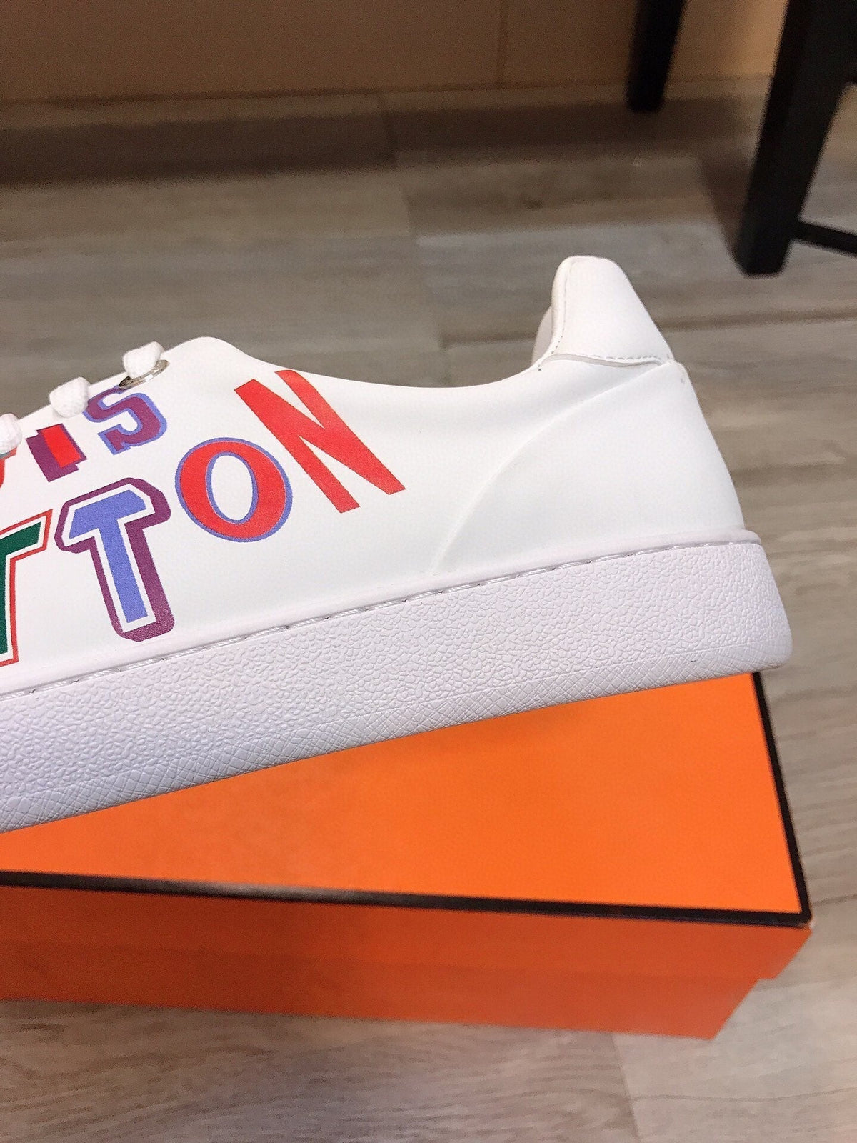 LV TRAINER WHITE CALFSKIN WITH COLORFUL LOGO