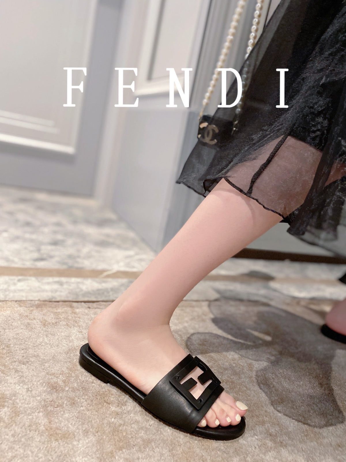 FENDI BAGUETTE SLIDES IN BLACK LAMBSKIN