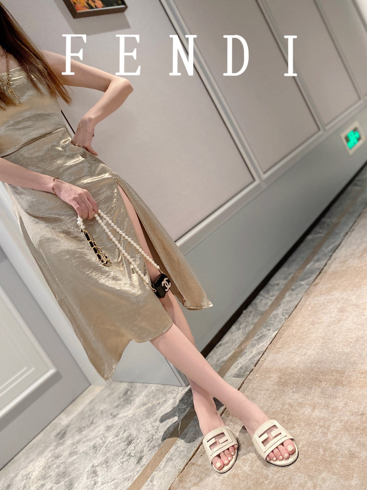FENDI BAGUETTE SLIDES IN WHITE LAMBSKIN
