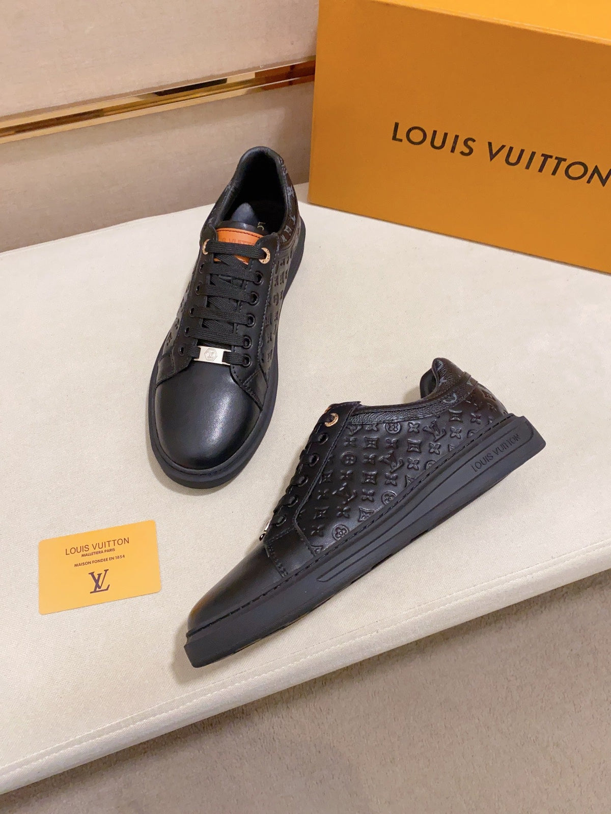LV RIVOLI SNEAKER BLACK MINI MONOGRAM-EMBOSSED CALFSKIN