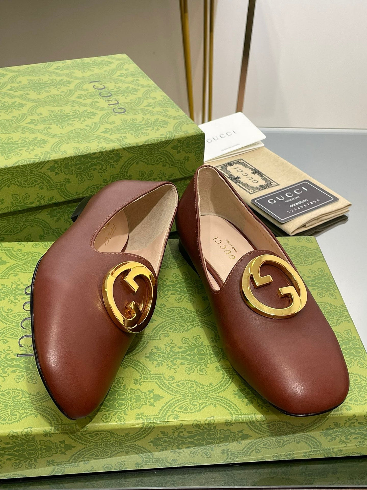 BLONDIE LOGO-PLAQUE LOAFERS IN SYRUP BROWN CALFSKIN