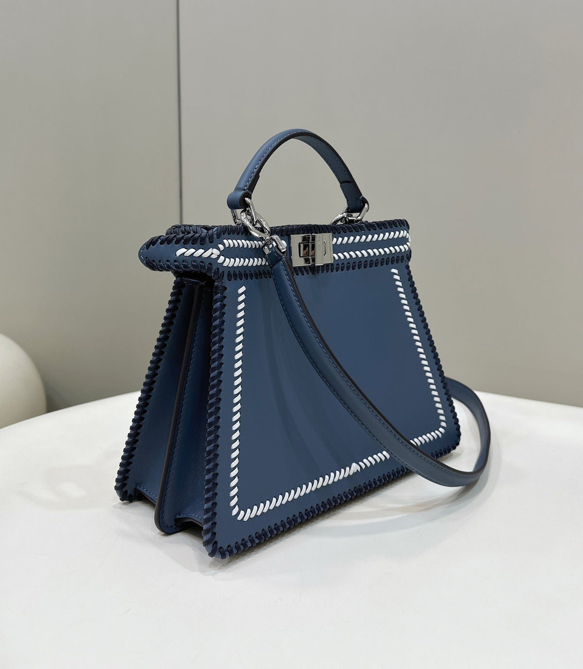 PEEKABOO ISEEU 27 IN BLUE BAYOUX INTERLACED CALFSKIN SILVER HARDWARE