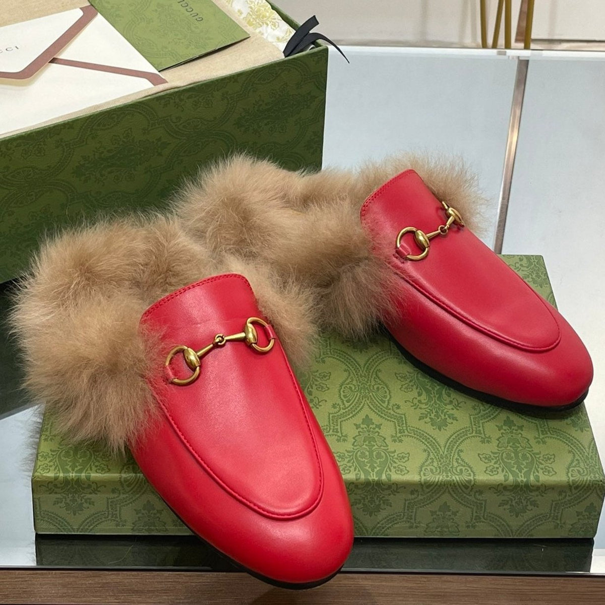 HORSEBIT MULE IN CHERRY RED CALFSKIN AND LAMB WOOL LINING