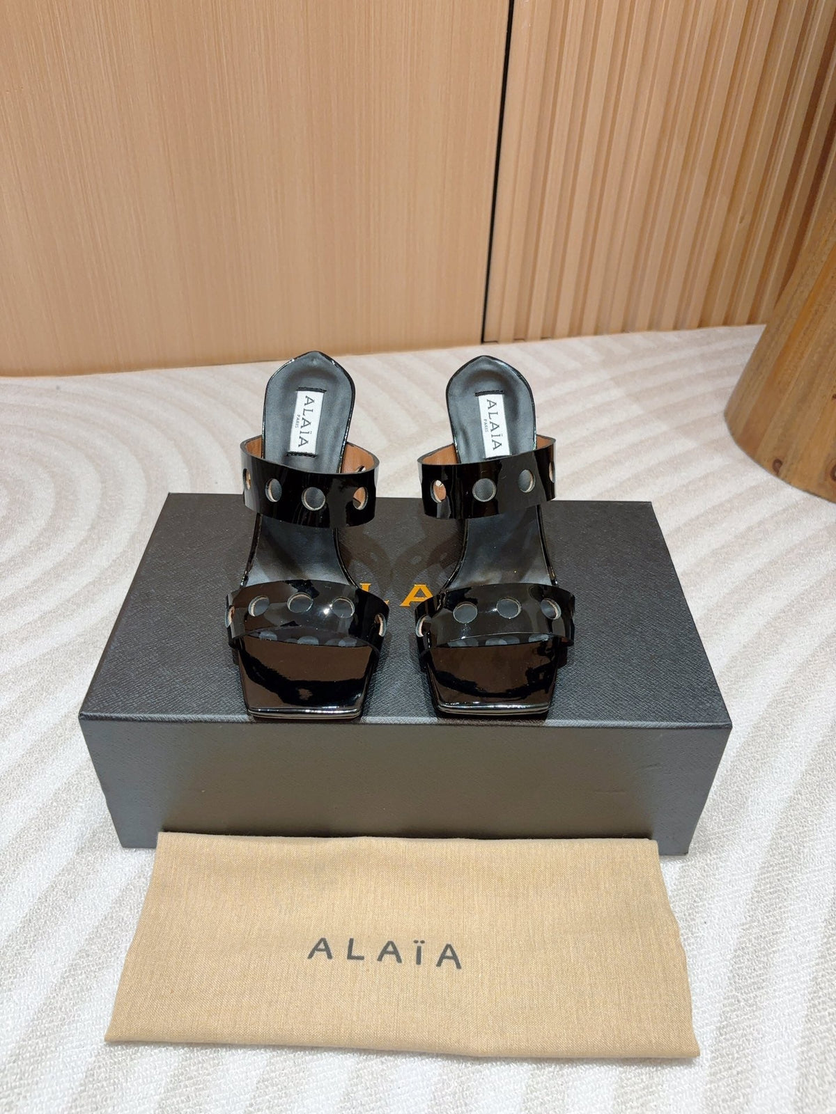 ALAIA TWO-STRAPS HIGH HEEL SANDALS IN BLACK PATENT LAMBSKIN