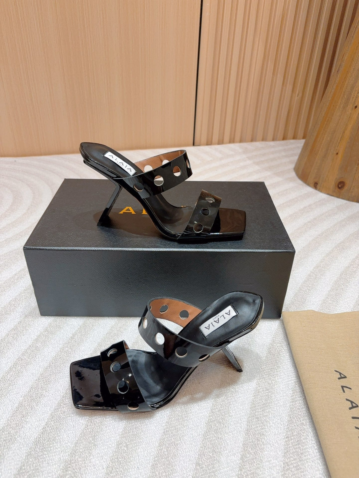 ALAIA TWO-STRAPS HIGH HEEL SANDALS IN BLACK PATENT LAMBSKIN