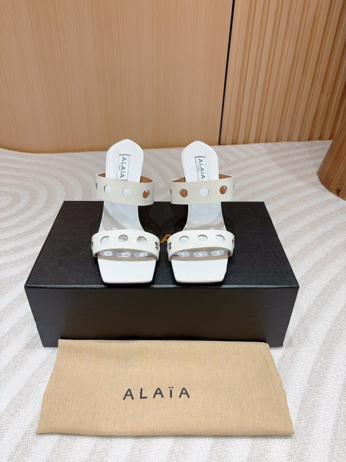 ALAIA TWO-STRAPS HIGH HEEL SANDALS IN WHITE PATENT LAMBSKIN