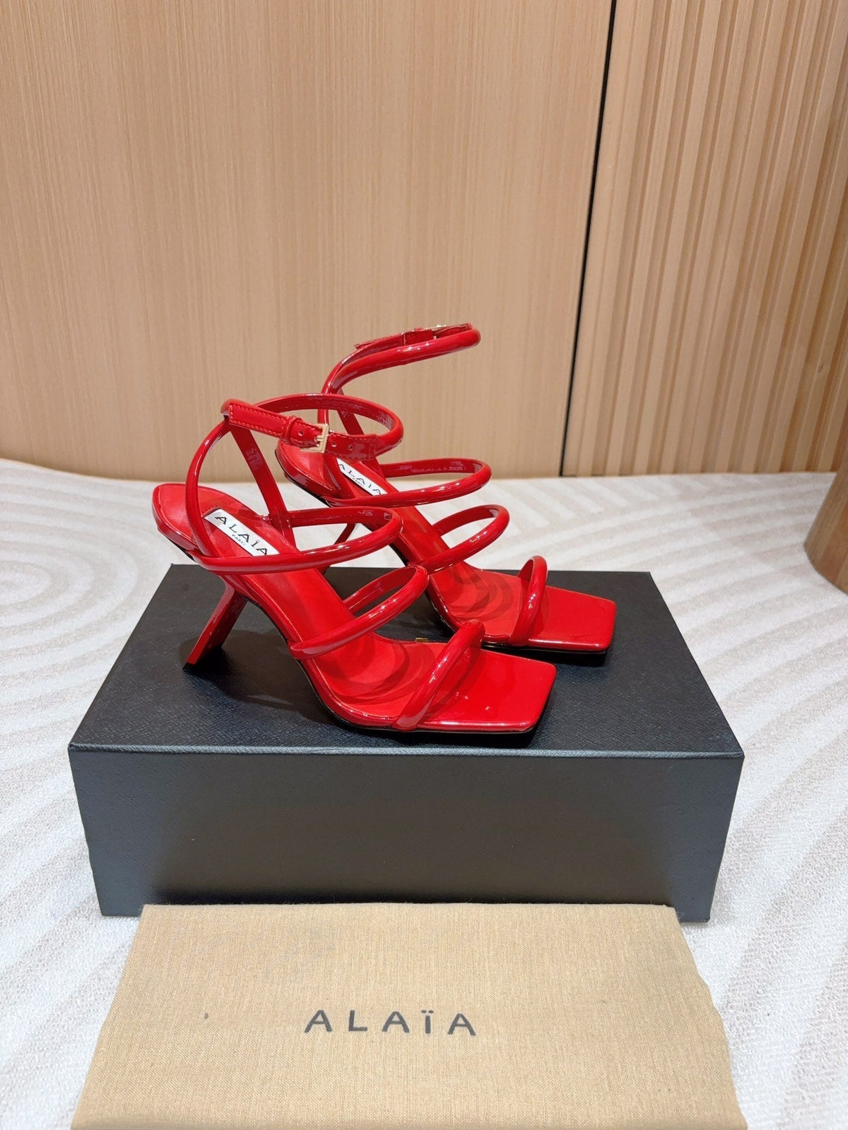 ALAIA THREE-STRAPS HIGH HEEL SANDALS IN CHERRY RED PATENT LAMBSKIN