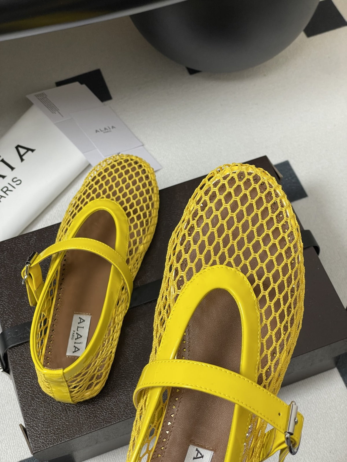 ALAIA BALLET FLATS IN YELLOW MESH FISHNET