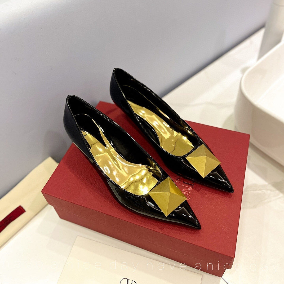 One Stud Gold Patent Black Leather Pump