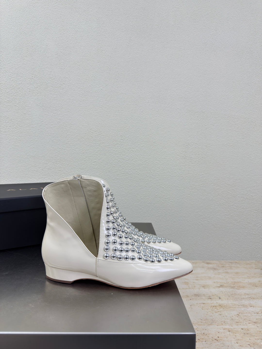 ALAIA Rivet ankle boots ivory cowhide leather 471092