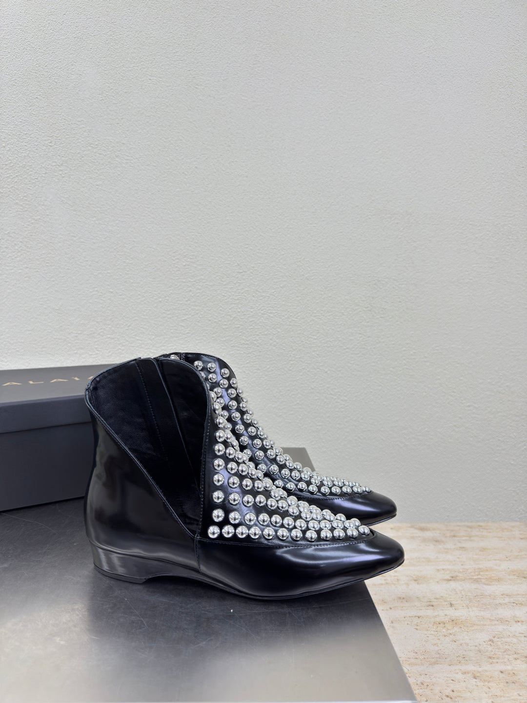 ALAIA Rivet ankle boots black cowhide leather 471093