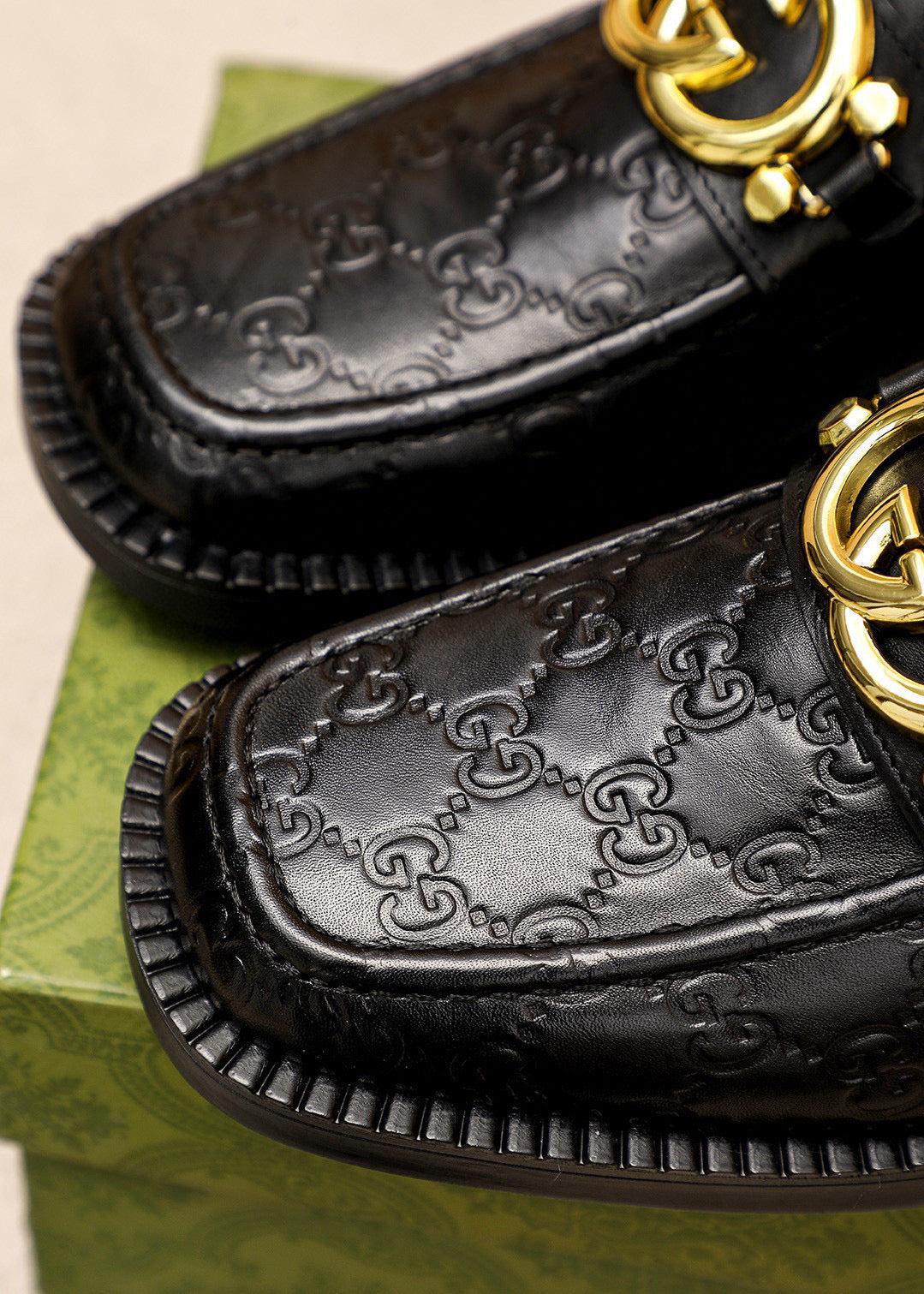 GG Men's Loafer Black GG Gold Embossed Cowhide 736976