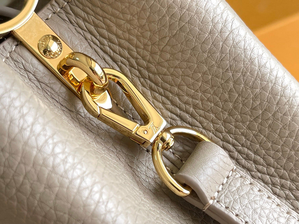 CAPUCINES BB 27 DARK BEIGE TAURILLON GOLD HARDWARE