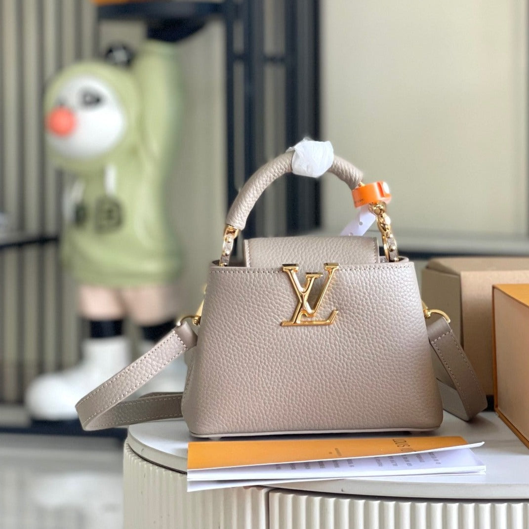 CAPUCINES MINI 21 DARK BEIGE TAURILLON GOLD HARDWARE