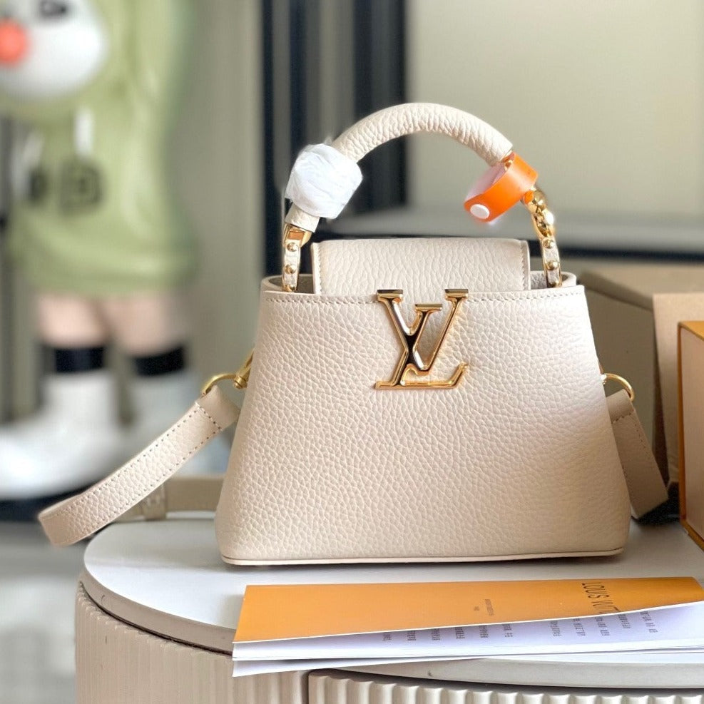 CAPUCINES MINI 21 BEIGE TAURILLON GOLD HARDWARE