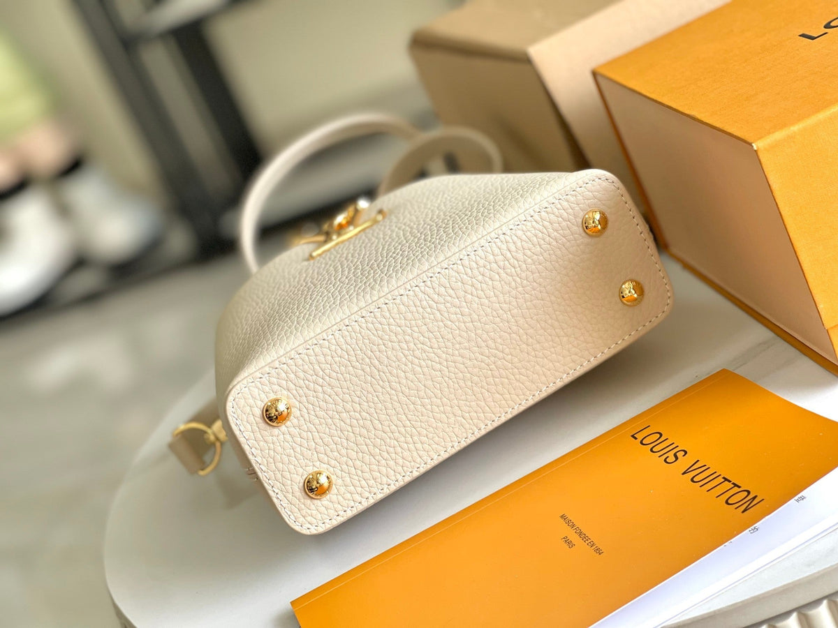 CAPUCINES BB 27 BEIGE TAURILLON GOLD HARDWARE