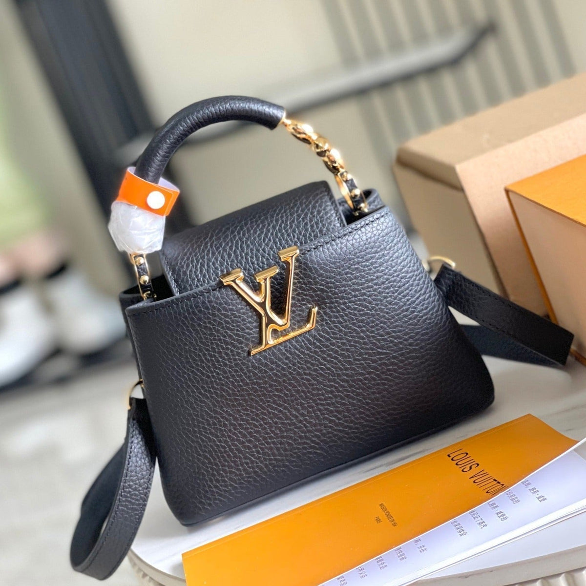 CAPUCINES MINI 21 BLACK TAURILLON GOLD HARDWARE