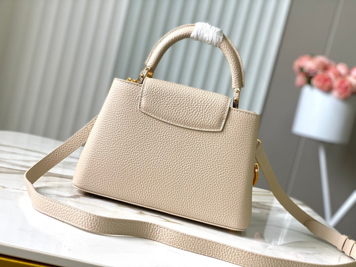 CAPUCINES BB 27CM BEIGE TAURILLON LEATHER