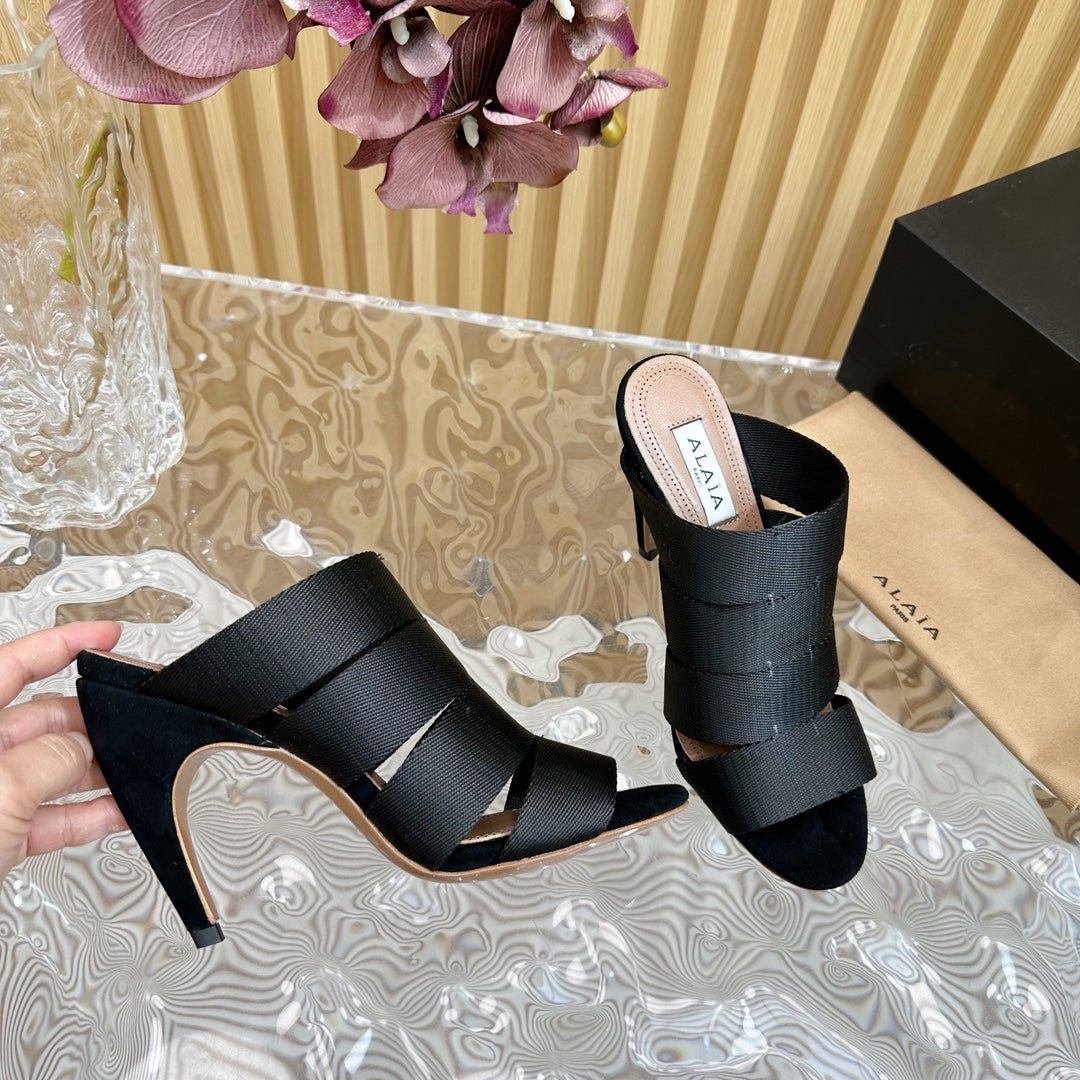 ALAIA ELASTIC CAGE MULE SANDALS IN BLACK WOVEN STRAP AND LAMBSKIN