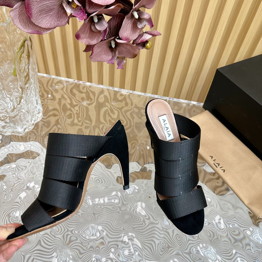 ALAIA ELASTIC CAGE MULE SANDALS IN BLACK WOVEN STRAP AND LAMBSKIN