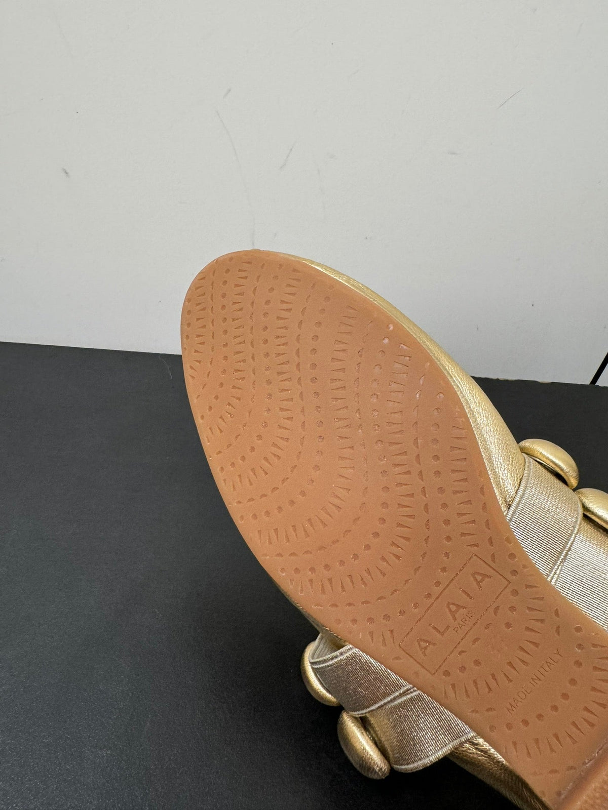 ALAIA SPHERE BALLET FLATS IN GOLDEN LAMBSKIN