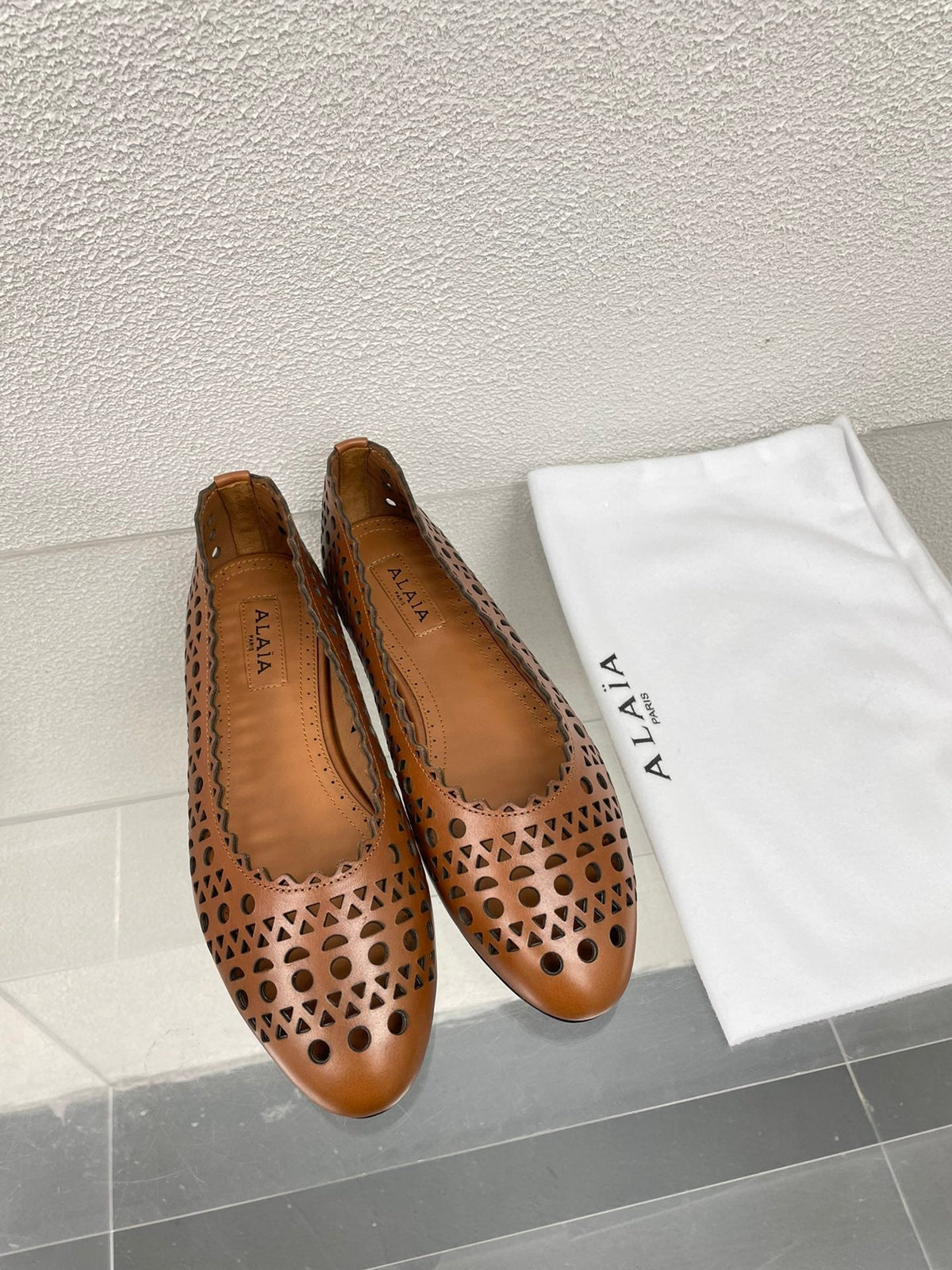 ALAIA BALLET FLAT IN CARAMEL BROWN MESH LAMBSKIN