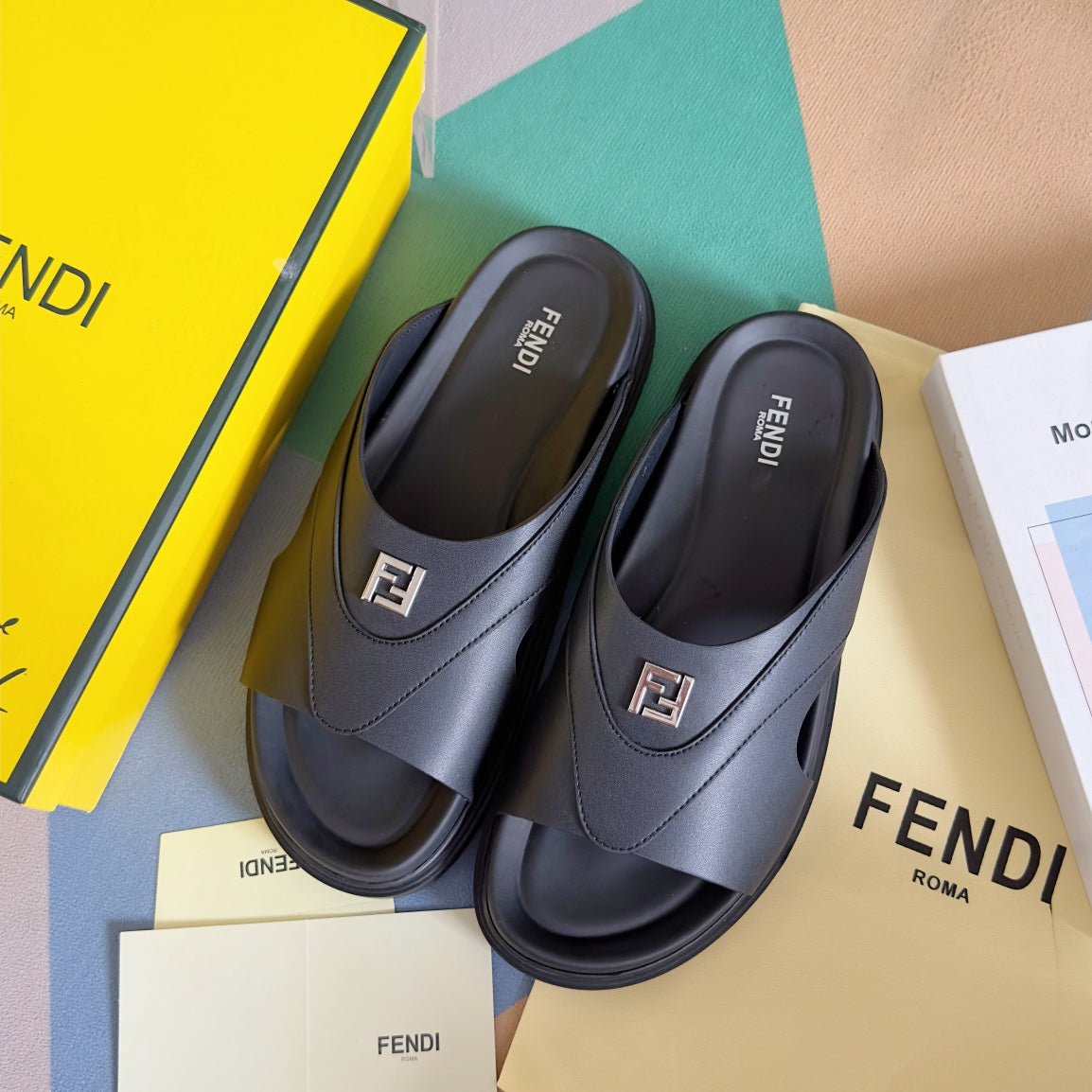 FENDI DIAGONAL ONE-STRAP SLIDE IN BLACK CALFSKIN AND RUBBER