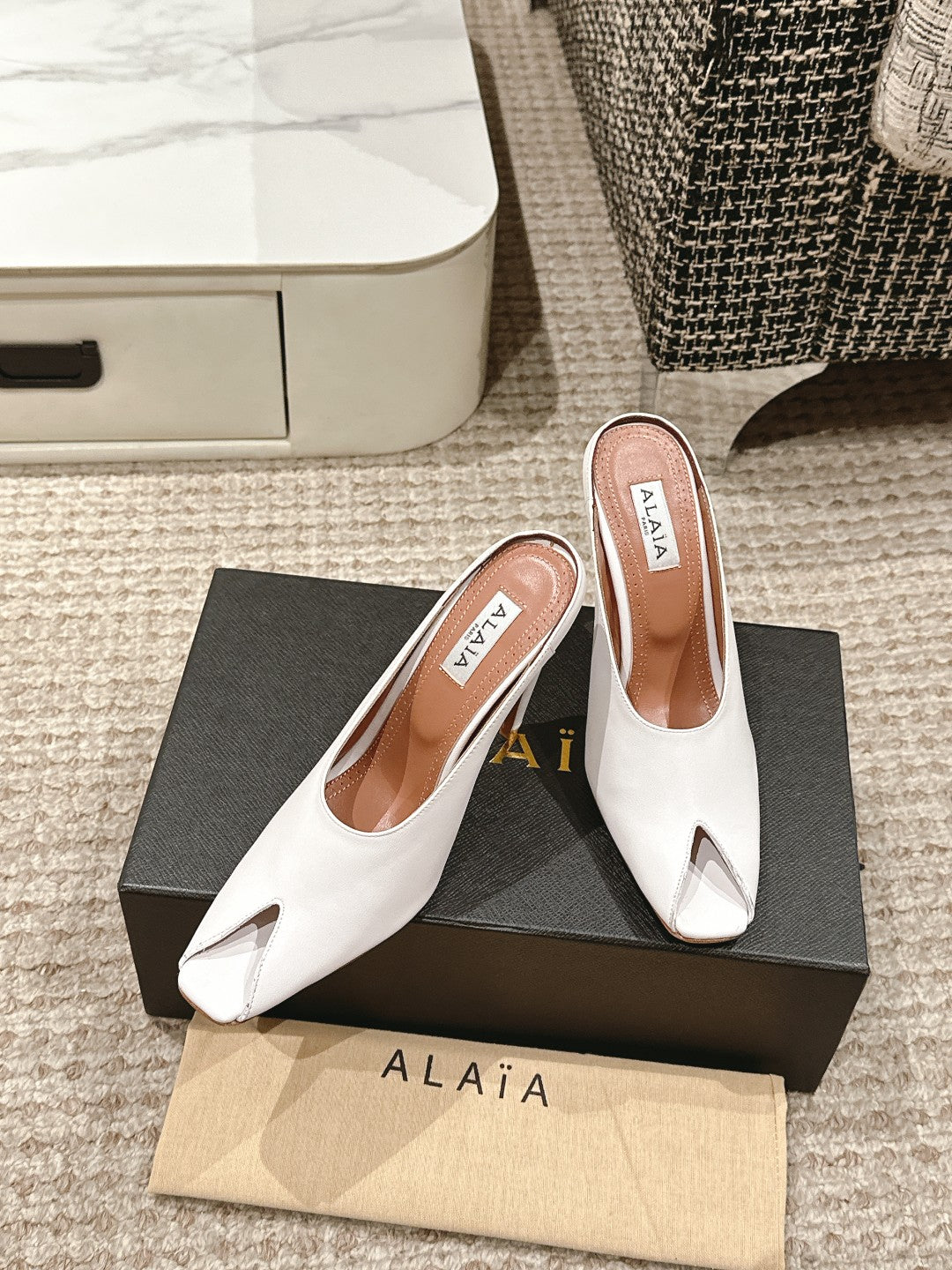 ALAIA SPIKE JEWEL MULES IN WHITE CALFSKIN