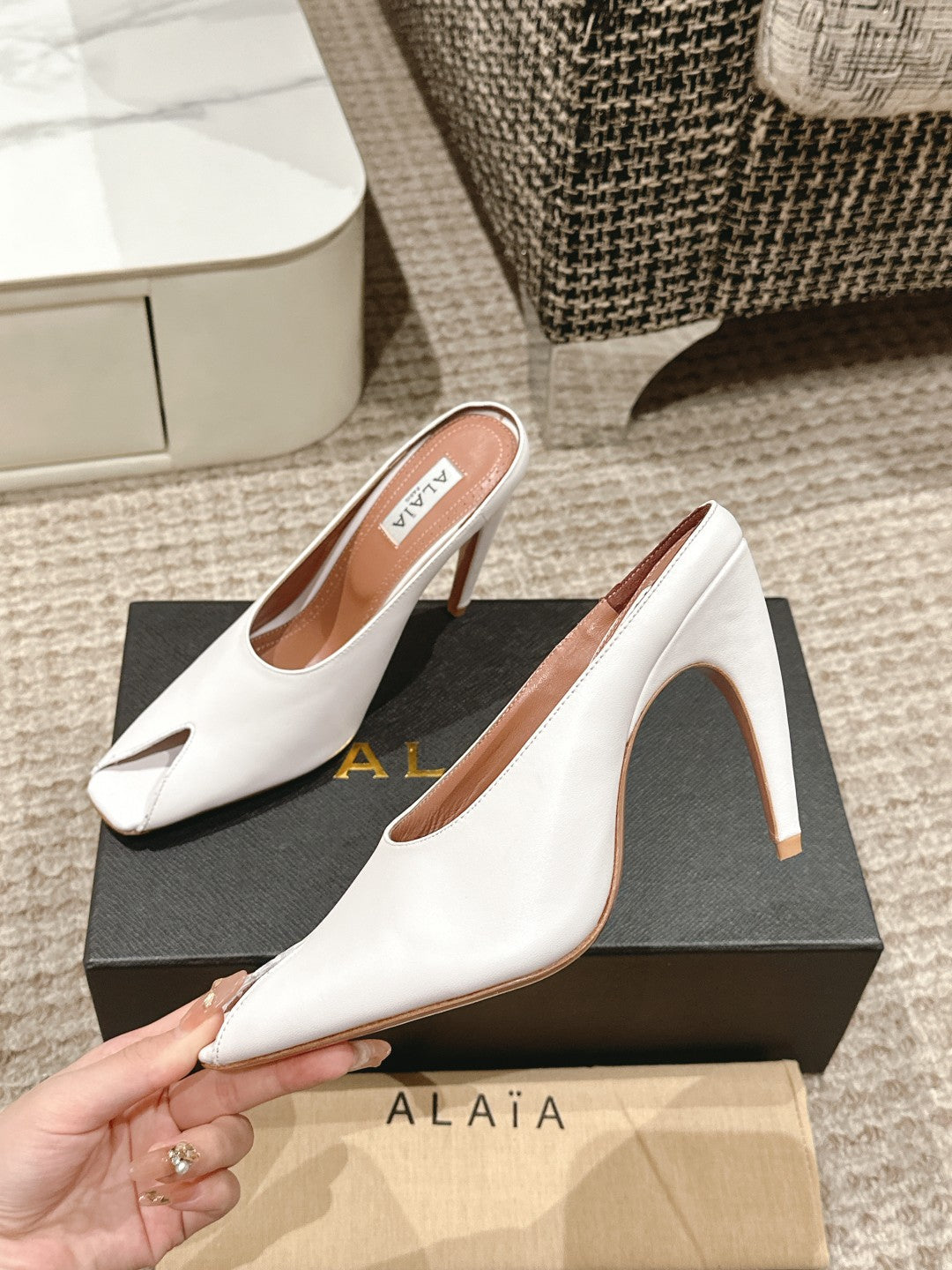 ALAIA SPIKE JEWEL MULES IN WHITE CALFSKIN