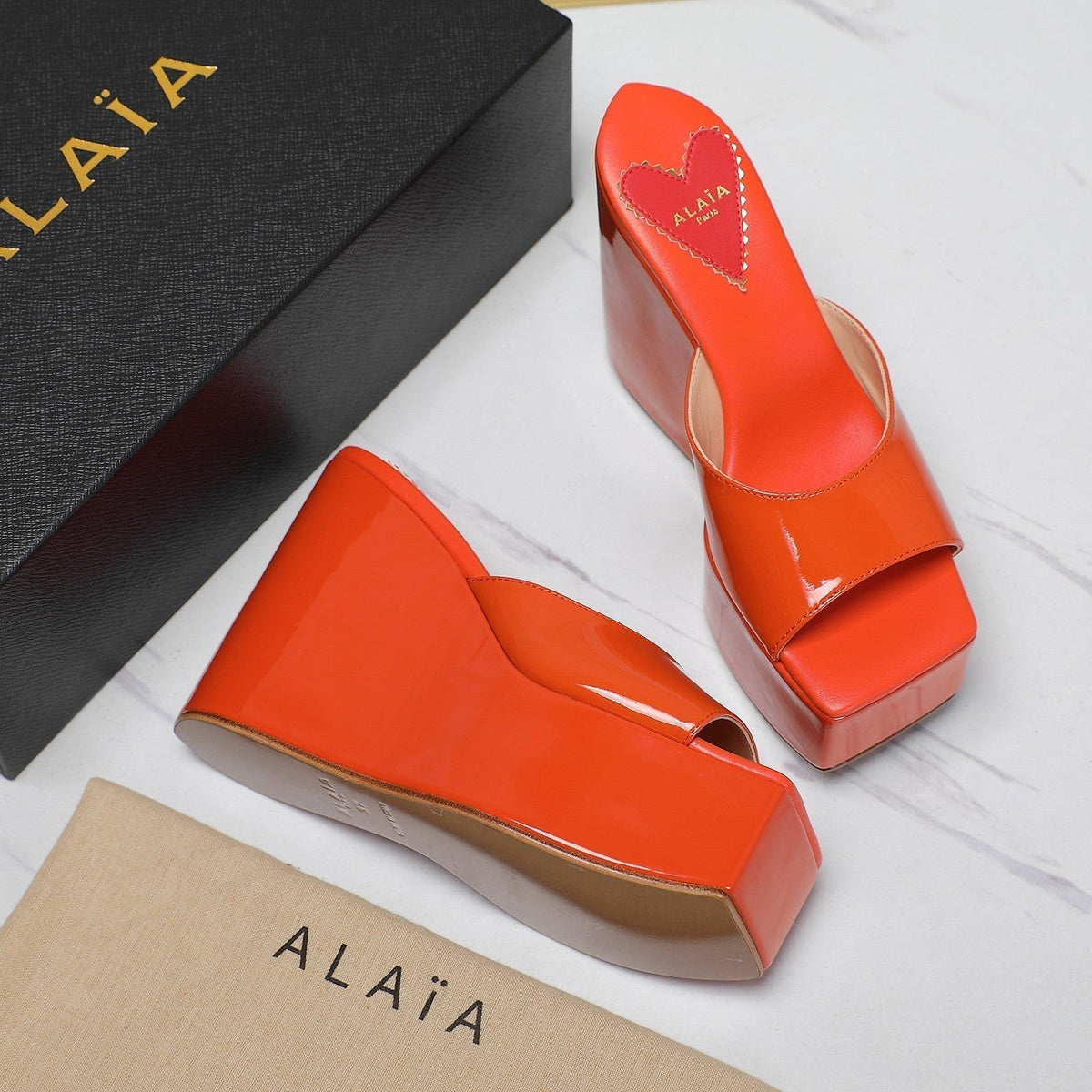 ALAIA PLATFORM WEDGE IN VIVID ORANGE LAMBSKIN WITH RED HEART