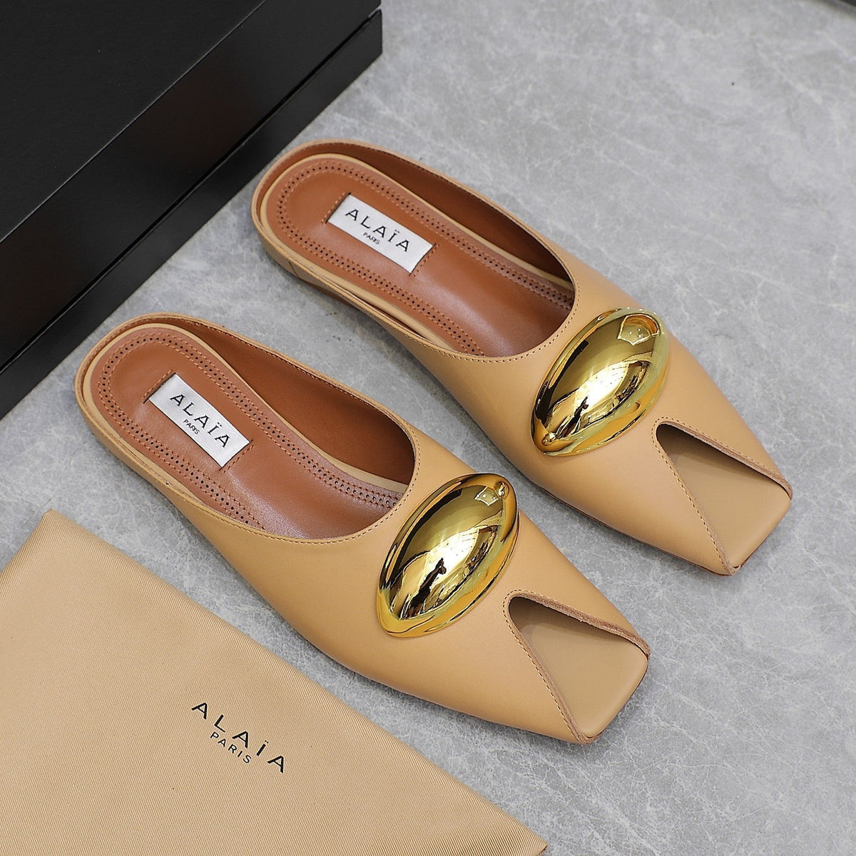 ALAIA FLAT MULE IN SEPIA TAN LAMBSKIN WITH GOLD HARDWARE