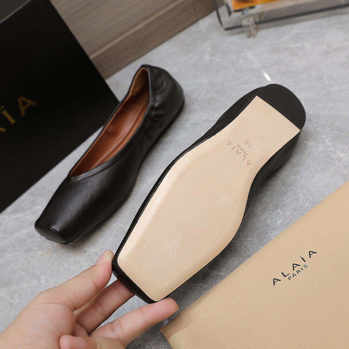 ALAIA BALLET FLATS IN BLACK SMOOTH CALFSKIN