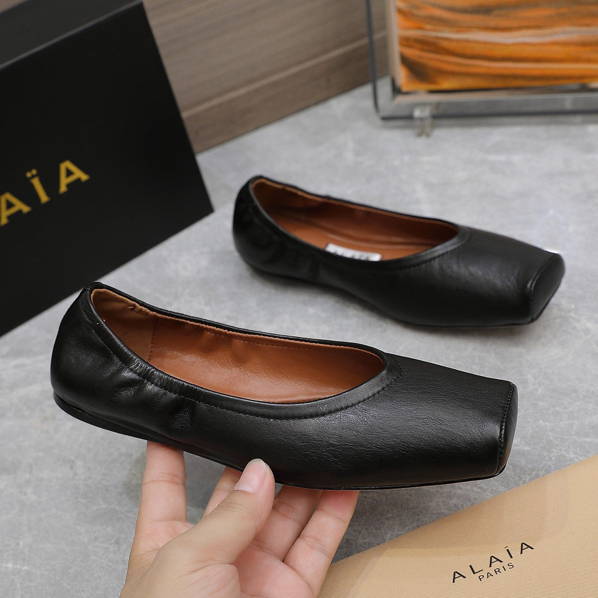 ALAIA BALLET FLATS IN BLACK SMOOTH CALFSKIN