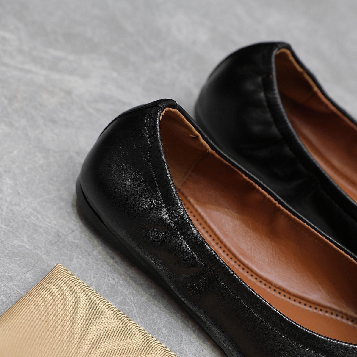 ALAIA BALLET FLATS IN BLACK SMOOTH CALFSKIN