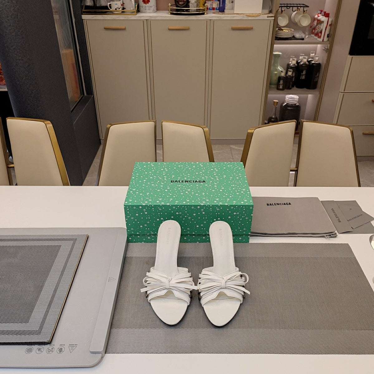 BOW-EMBELLISHED HIGH MULES IN WHITE SHEEPSKIN